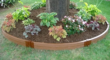 From a neglected area to a showy place in the garden – Stylish decorations and flower beds for under the tree